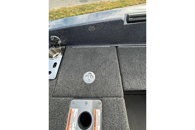 Slide: The Image of 2026 Lund 219 Pro-V GL boat interior with seating and dashboard view. - 25