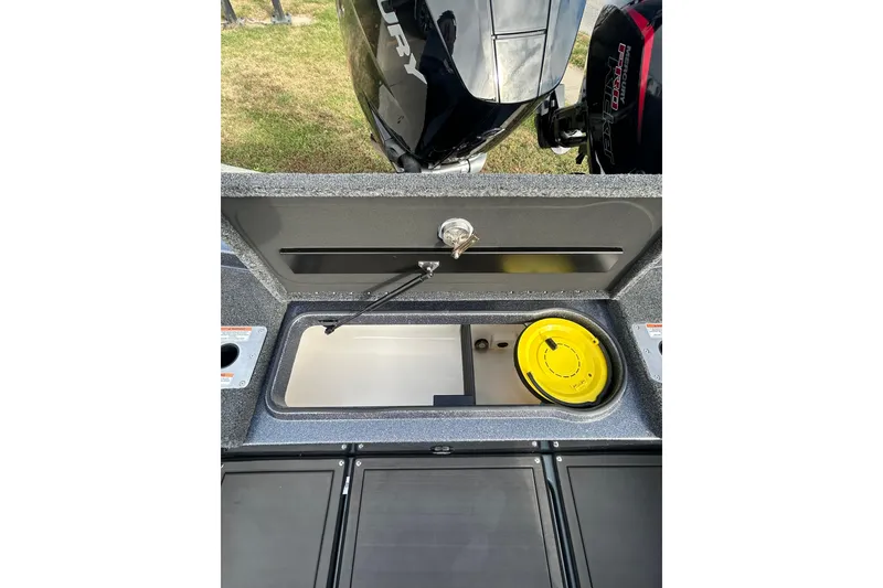 Slide: The Image of 2026 Lund 219 Pro-V GL boat interior with steering wheel and seating. - 26