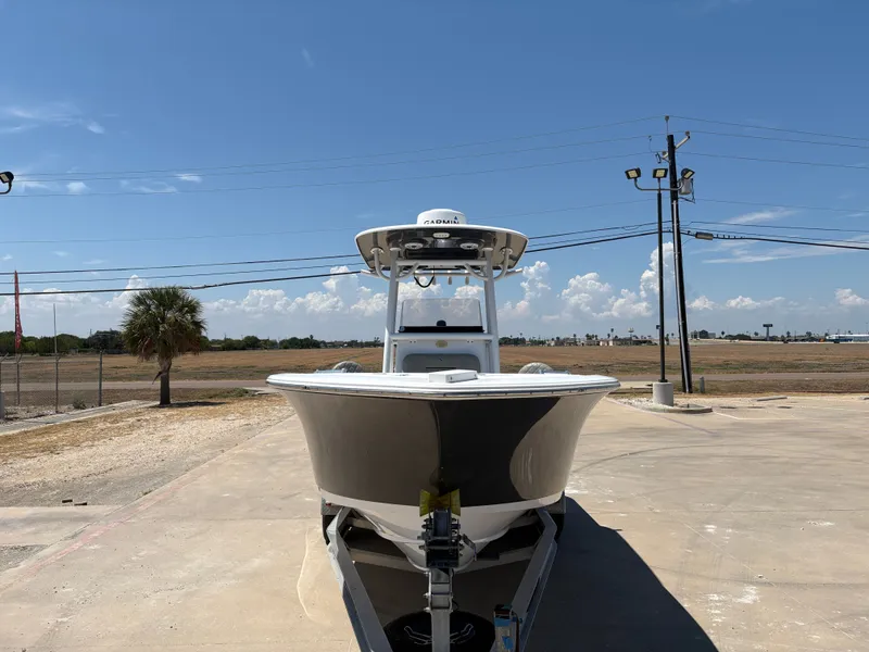 Slide: The Image of 2021 Sportsman Heritage 241 Center Console boat on trailer under clear blue sky. - 5