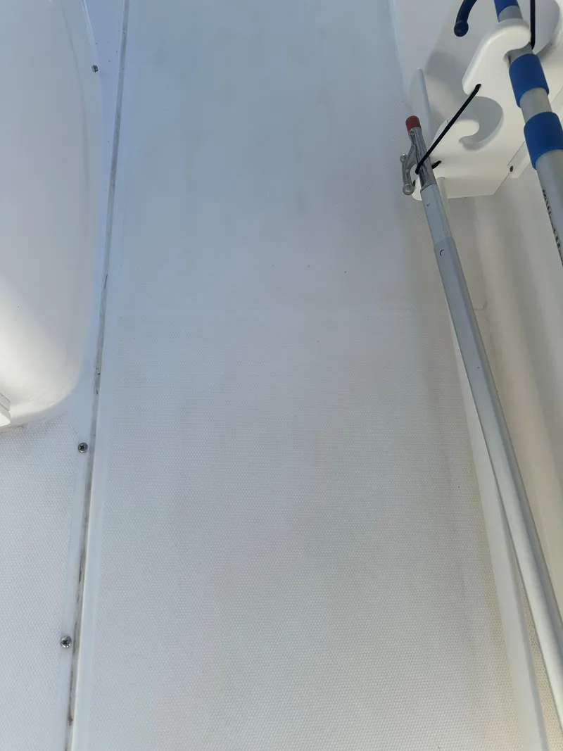 Slide: The Image of Close-up of a boat deck with fishing rod holder. - 36