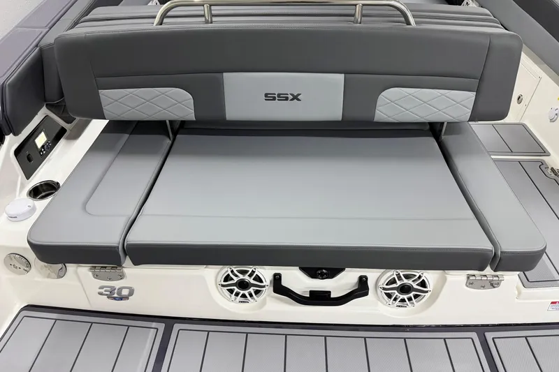 Slide: The Image of 2026 Chaparral 30 SSX boat interior with gray seating and speaker system. - 14