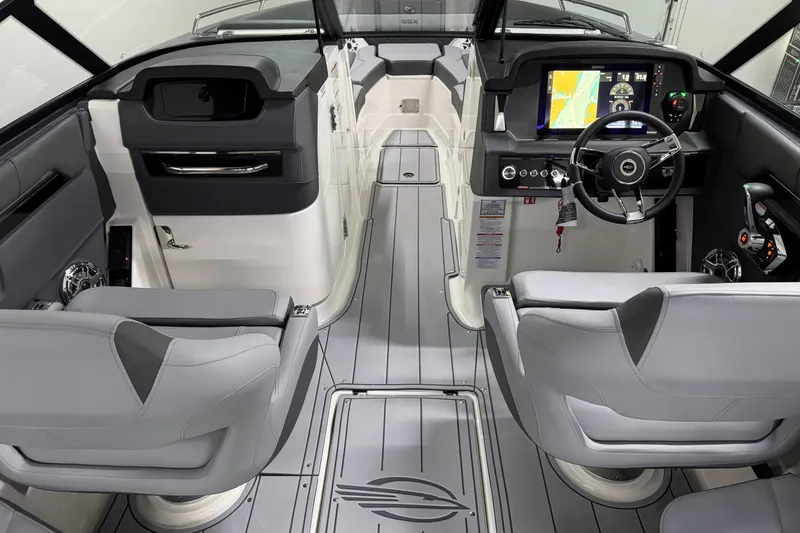 Slide: The Image of Interior of 2026 Chaparral 30 SSX boat with modern dashboard and seating. - 18