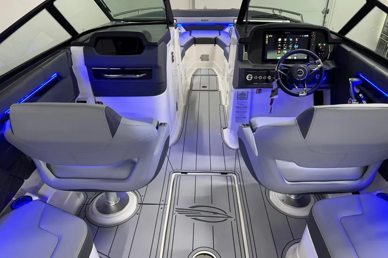 Slide: The Image of Interior of 2026 Chaparral 30 SSX boat with modern dashboard and seating. - 19