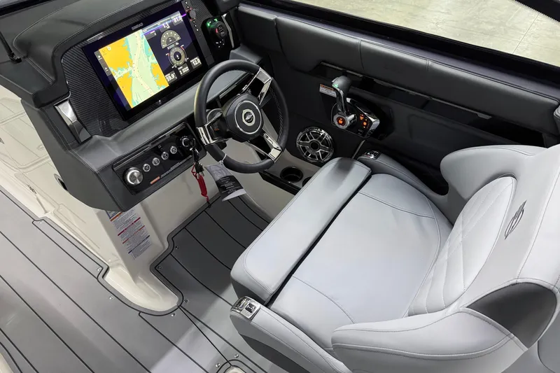 Slide: The Image of 2026 Chaparral 30 SSX boat cockpit with modern steering and navigation system. - 20