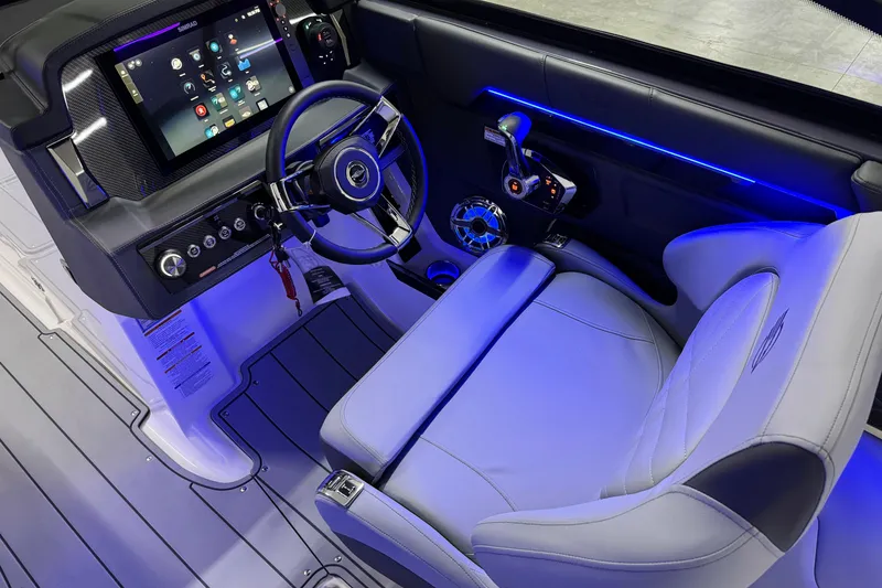 Slide: The Image of 2026 Chaparral 30 SSX boat cockpit with modern steering and digital controls. - 21