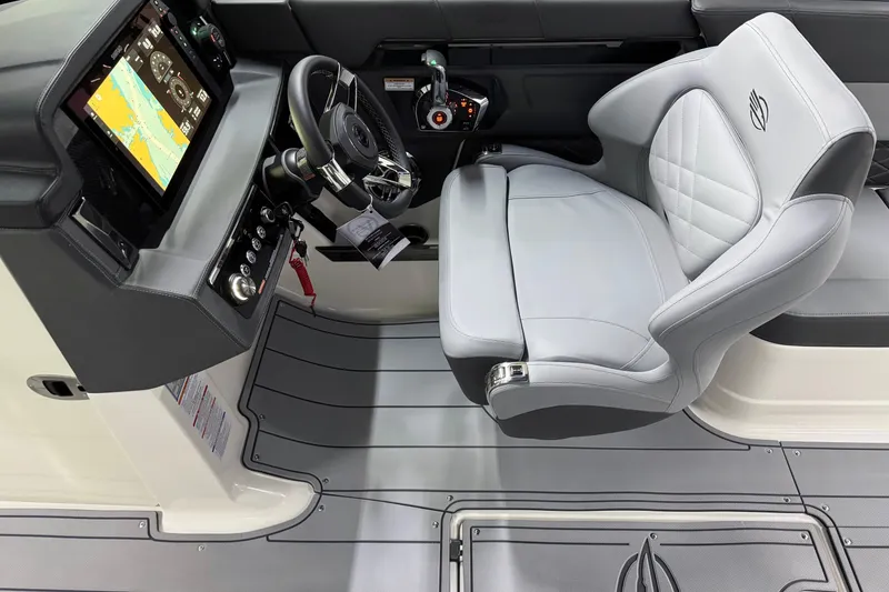 Slide: The Image of 2026 Chaparral 30 SSX cockpit with modern steering and navigation display. - 22