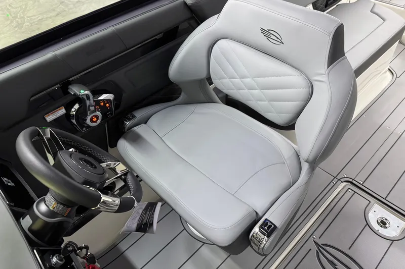 Slide: The Image of 2026 Chaparral 30 SSX cockpit with sleek steering wheel and luxurious seating. - 24