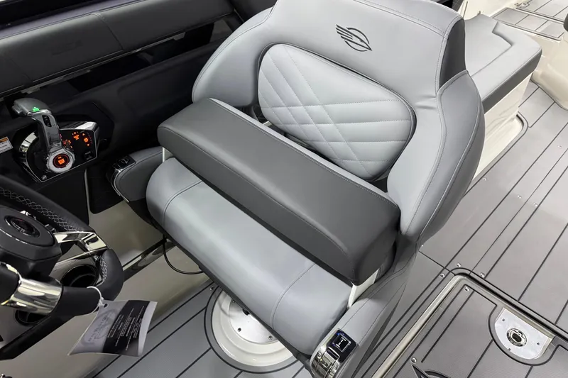 Slide: The Image of 2026 Chaparral 30 SSX boat interior with luxurious gray seating and modern controls. - 25