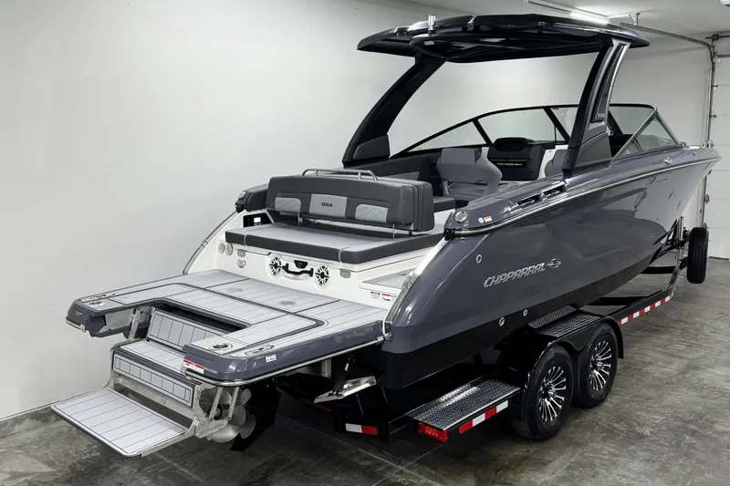 Slide: The Image of 2026 Chaparral 30 SSX boat on trailer in a garage setting. - 3