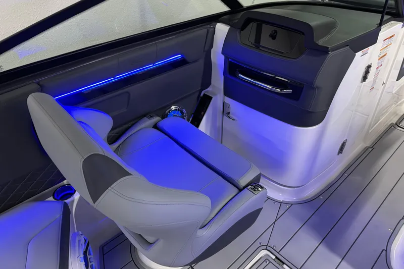 Slide: The Image of Interior of 2026 Chaparral 30 SSX boat with modern seating and blue LED lighting. - 30