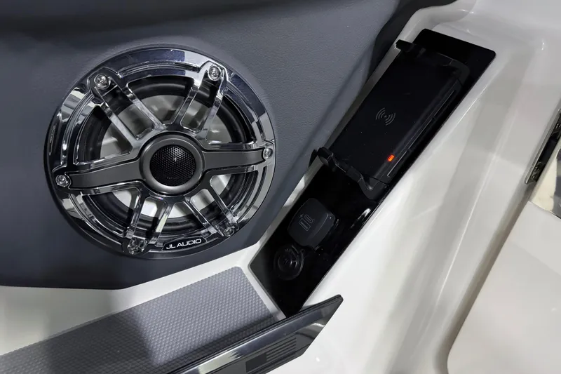 Slide: The Image of Speaker and charging station on 2026 Chaparral 30 SSX boat dashboard. - 31