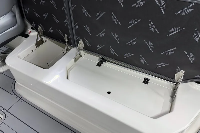 Slide: The Image of 2026 Chaparral 30 SSX boat storage compartments with branded interior lining. - 42