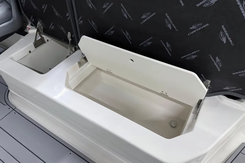 Slide: The Image of Open storage compartment on 2026 Chaparral 30 SSX boat, featuring sleek design and ample space. - 43
