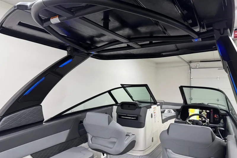 Slide: The Image of 2026 Chaparral 30 SSX boat interior with modern helm and seating. - 44