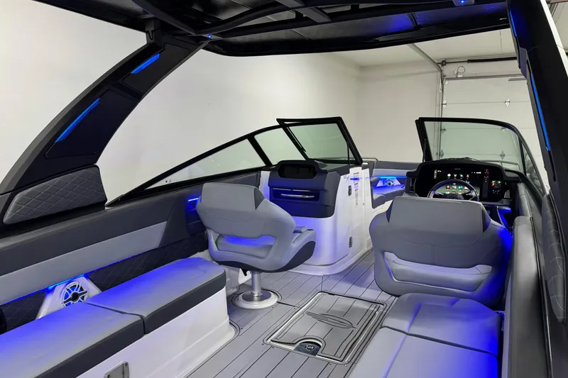 Slide: The Image of 2026 Chaparral 30 SSX boat interior with modern seating and blue LED lighting. - 45