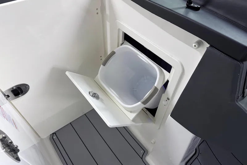 Slide: The Image of 2026 Chaparral 30 SSX boat interior with built-in storage compartment. - 53