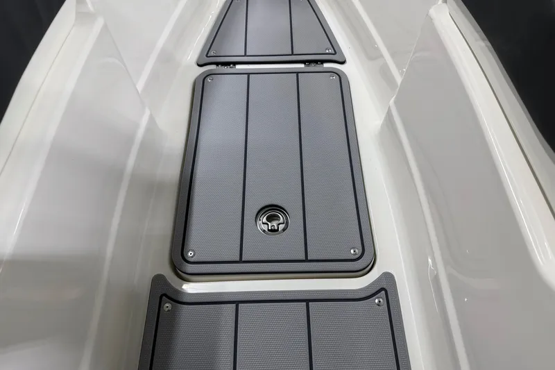 Slide: The Image of 2026 Chaparral 30 SSX boat deck with sleek, modern storage compartments. - 56