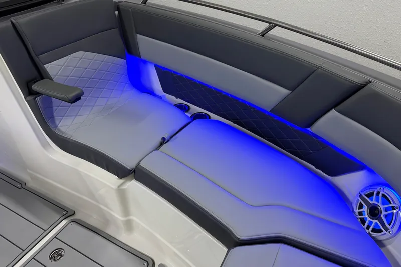 Slide: The Image of 2026 Chaparral 30 SSX boat interior with blue LED lighting and quilted seating. - 59
