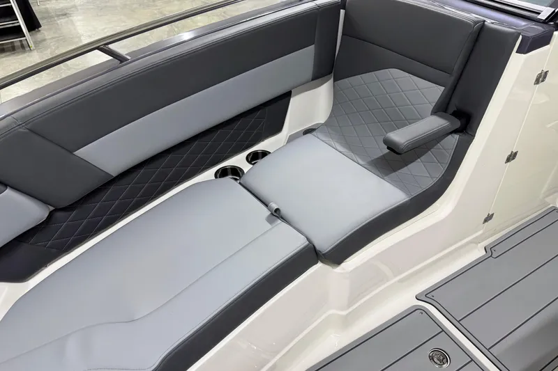 Slide: The Image of 2026 Chaparral 30 SSX boat interior with sleek gray seating and diamond stitching. - 60