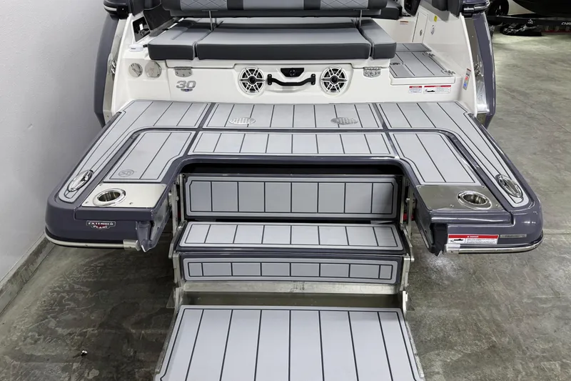 Slide: The Image of 2026 Chaparral 30 SSX boat with extended swim platform and seating area. - 65