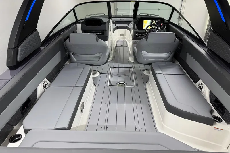 Slide: The Image of 2026 Chaparral 30 SSX boat interior with sleek gray seating and modern dashboard. - 7
