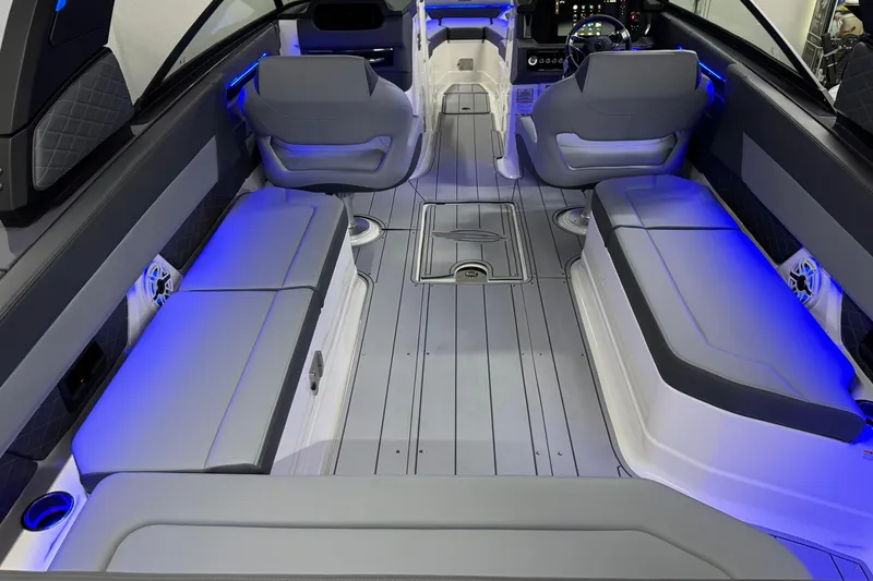 Slide: The Image of 2026 Chaparral 30 SSX boat interior with modern seating and ambient blue lighting. - 8