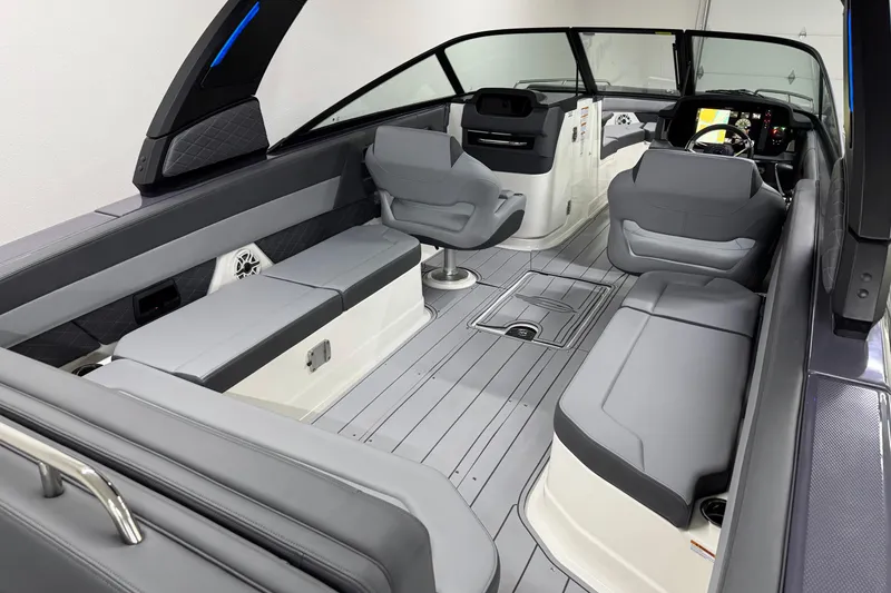 Slide: The Image of 2026 Chaparral 30 SSX boat interior with sleek seating and modern dashboard design. - 9