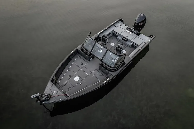 Slide: The Image of Manufacturer Provided Image: 2026 Lund 2075 Impact XS fishing boat on calm water, aerial view. - 2
