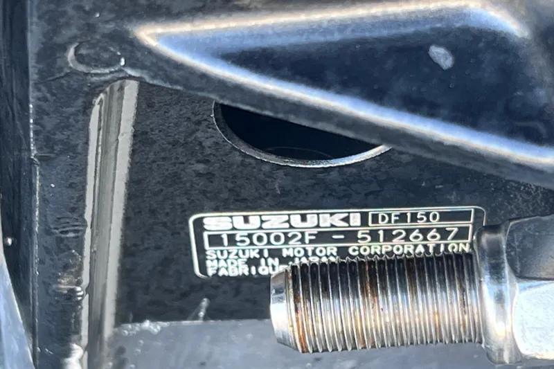 Slide: The Image of Close-up of Suzuki DF150 engine label on a 2013 Carolina Skiff 218 DLV boat. - 10