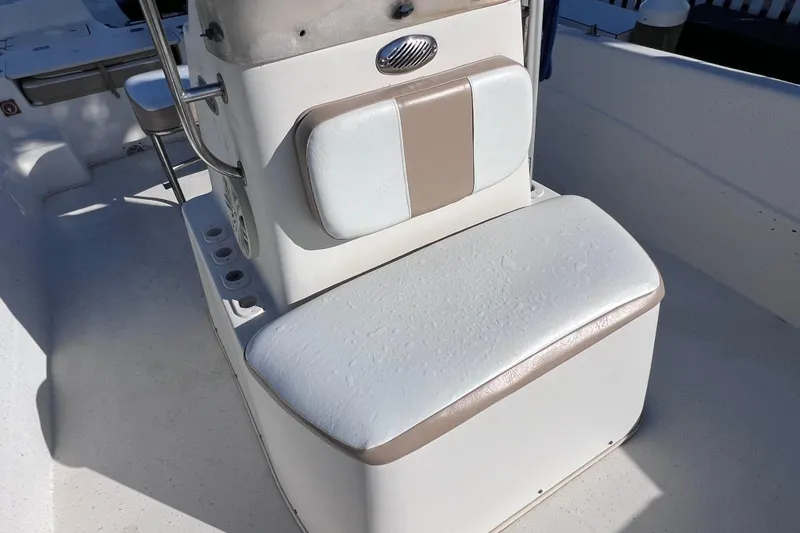Slide: The Image of 2013 Carolina Skiff 218 DLV boat seat with white and beige upholstery. - 23