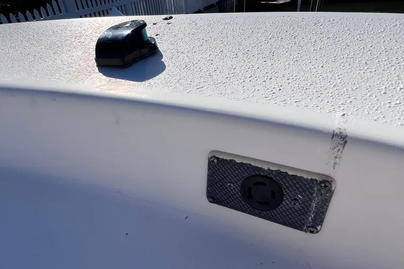 Slide: The Image of 2013 Carolina Skiff 218 DLV boat deck with textured surface and mounted hardware. - 26