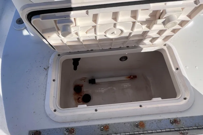 Slide: The Image of Open storage compartment on a 2013 Carolina Skiff 218 DLV boat. - 29