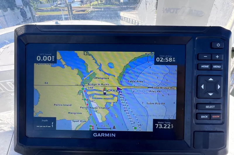Slide: The Image of Garmin GPS display on a 2013 Carolina Skiff 218 DLV, showing a nautical map. - 31