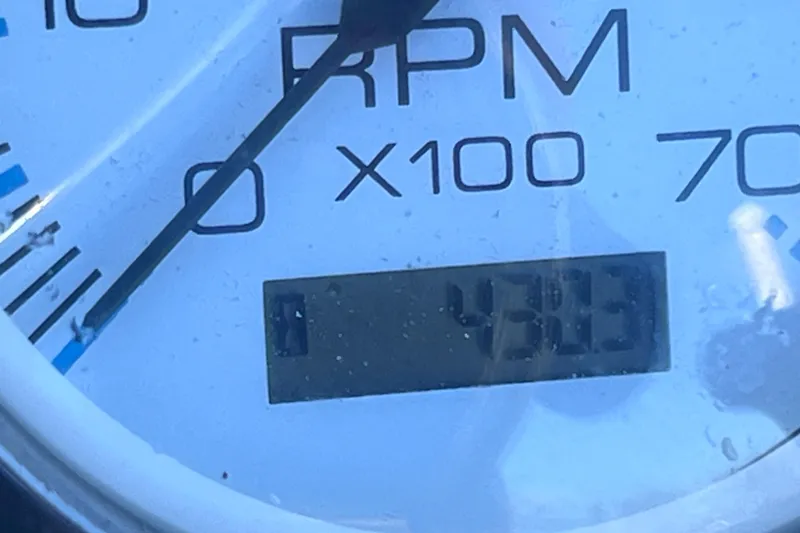 Slide: The Image of Close-up of a Carolina Skiff 218 DLV 2013 RPM gauge displaying 4803 RPM. - 32