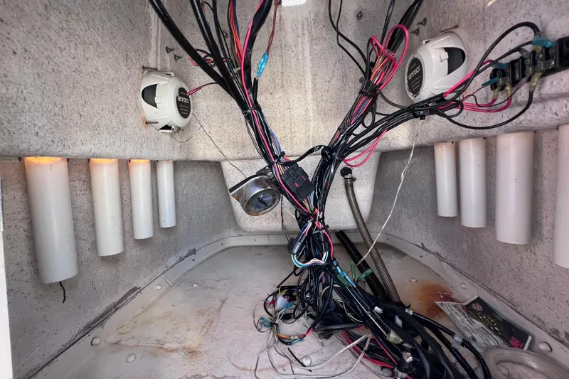 Slide: The Image of Interior wiring of a 2013 Carolina Skiff 218 DLV boat, showing cables and speakers. - 34