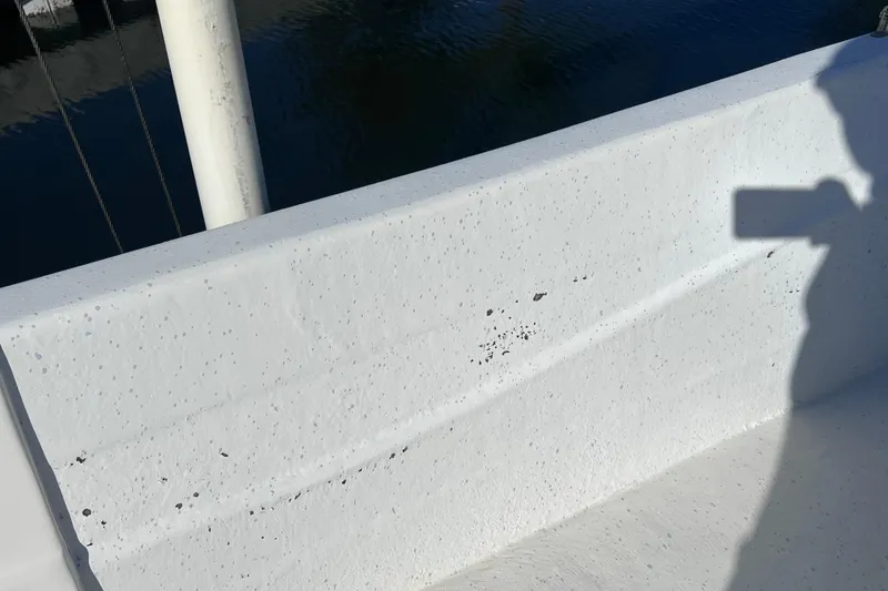 Slide: The Image of 2013 Carolina Skiff 218 DLV boat interior with visible wear and shadow. - 38