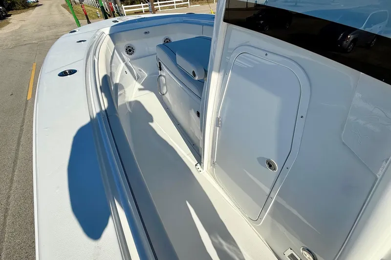 Slide: The Image of 2026 Sea Hunt Ultra 275 Coffin Box boat interior with storage and seating. - 12
