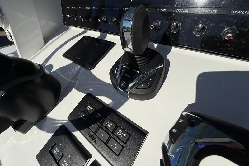 Slide: The Image of Control panel of 2026 Sea Hunt Ultra 275 Coffin Box boat with joystick and switches. - 18