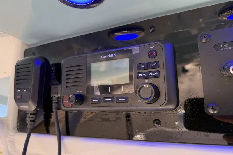 Slide: The Image of Garmin marine radio on 2026 Sea Hunt Ultra 275 Coffin Box boat dashboard. - 19