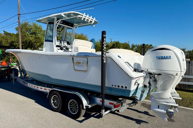 Slide: The Image of 2026 Sea Hunt Ultra 275 Coffin Box boat on trailer with Yamaha engine. - 2