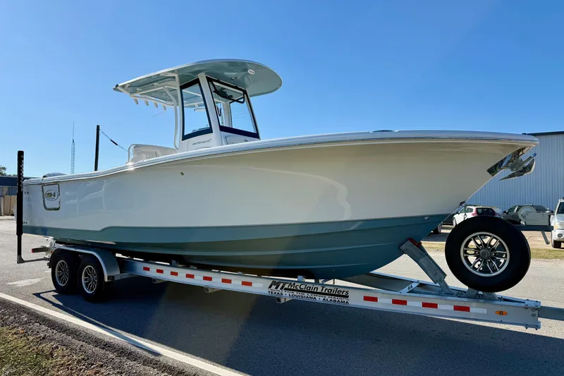 Slide: The Image of 2026 Sea Hunt Ultra 275 Coffin Box boat on trailer, parked outdoors. - 5