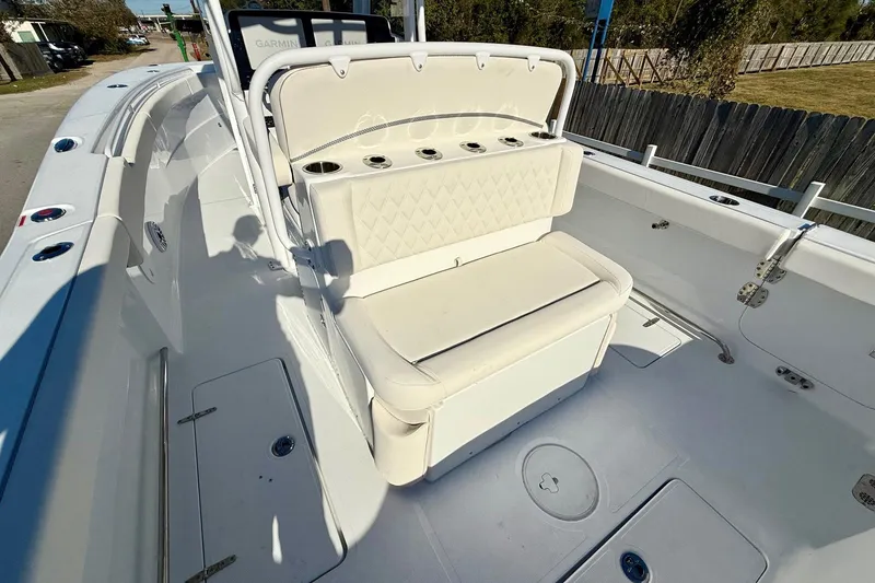 Slide: The Image of 2026 Sea Hunt Ultra 275 Coffin Box boat interior with cushioned seating and storage. - 8