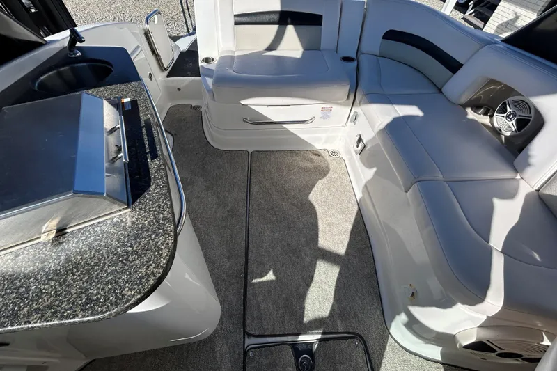 Slide: The Image of 2009 Chaparral Sunesta 264 interior with seating, sink, and grill on deck. - 14