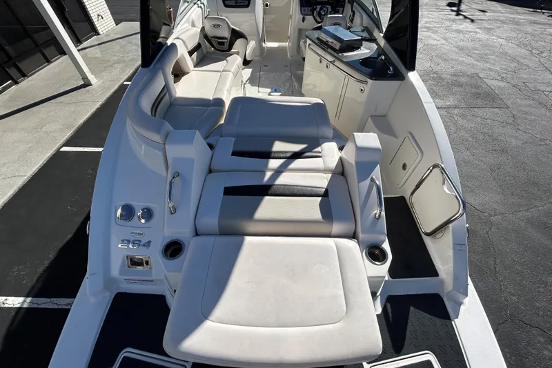Slide: The Image of 2009 Chaparral Sunesta 264 boat interior with seating and dashboard view. - 19