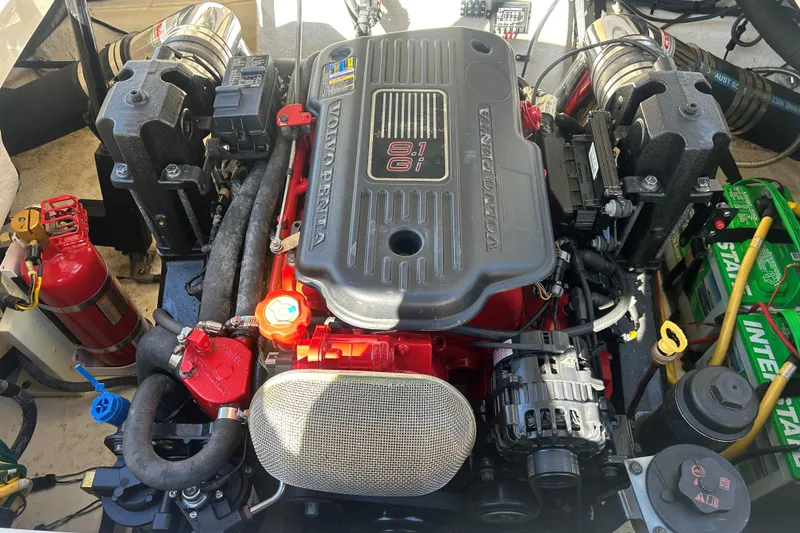 Slide: The Image of Volvo Penta engine in 2009 Chaparral Sunesta 264 boat, featuring detailed components and fire extinguisher. - 24