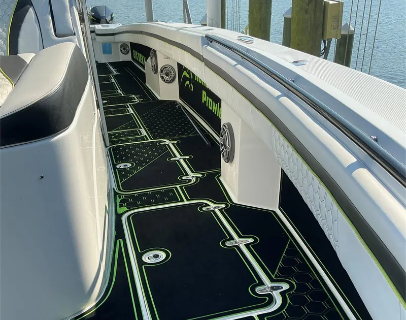 Slide: The Image of 2020 Prowler 42 boat interior with custom black and green flooring design. - 29