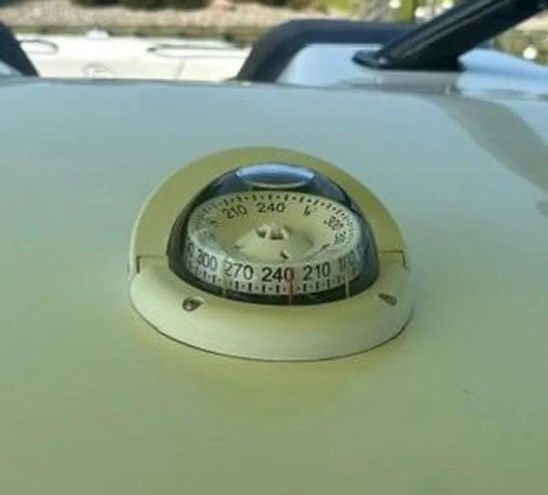 Slide: The Image of Close-up of a compass on a 2020 Prowler 42 boat deck. - 34