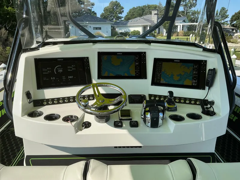 Slide: The Image of Helm of 2020 Prowler 42 boat with advanced navigation displays and controls. - 9