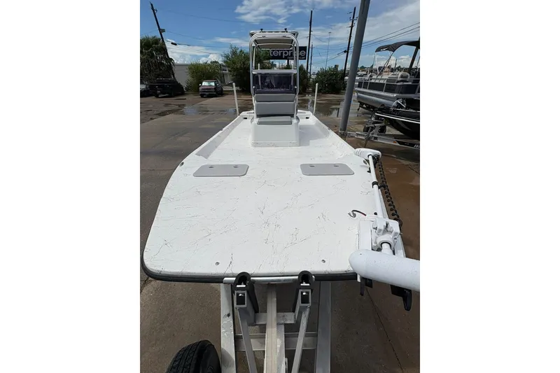 Slide: The Image of 2023 Shoalwater 23 Catamaran on trailer, showcasing spacious deck and sleek design. - 12