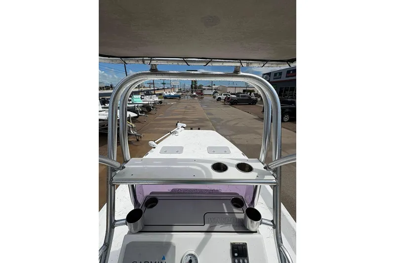 Slide: The Image of 2023 Shoalwater 23 Catamaran interior view with console and cup holders. - 14